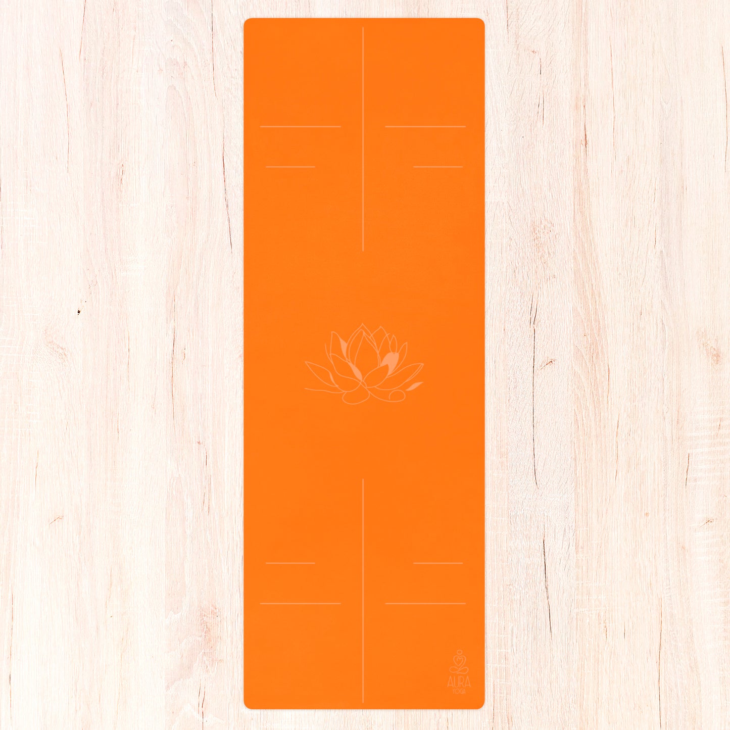 Orange suede yoga mat with line art lotus flower in the center and alignment lines