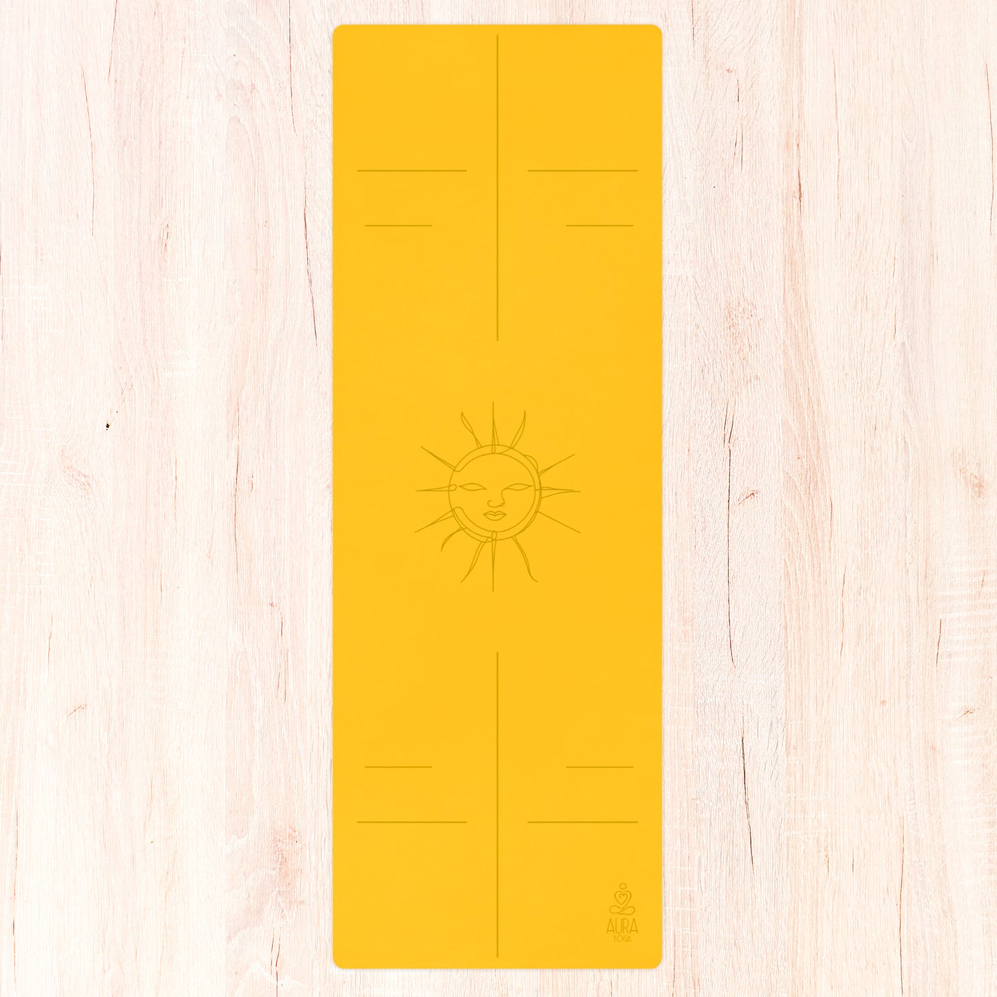 Yellow suede yoga mat with line art sun in the center and alignment lines