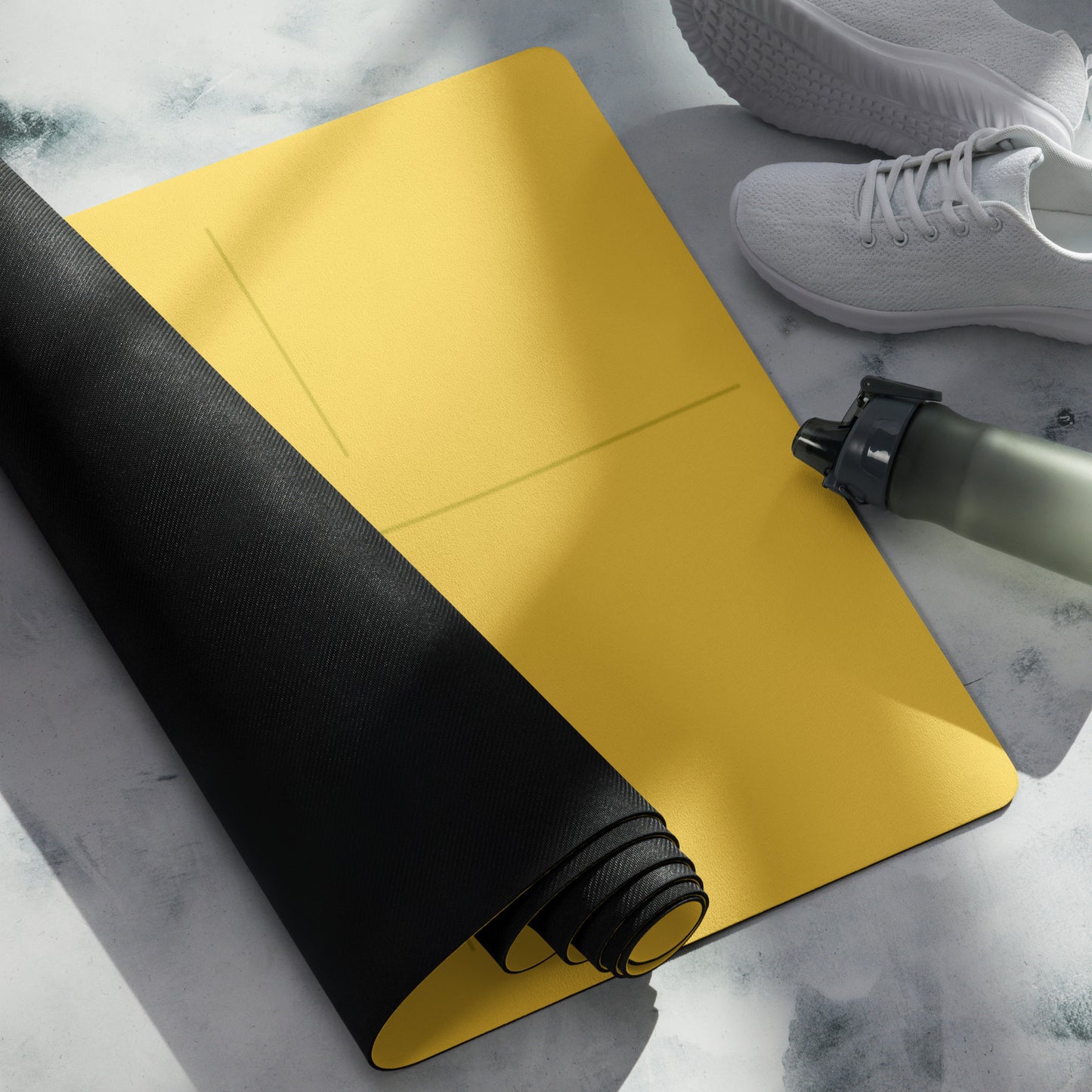 Rolled yellow suede yoga mat with alignment lines