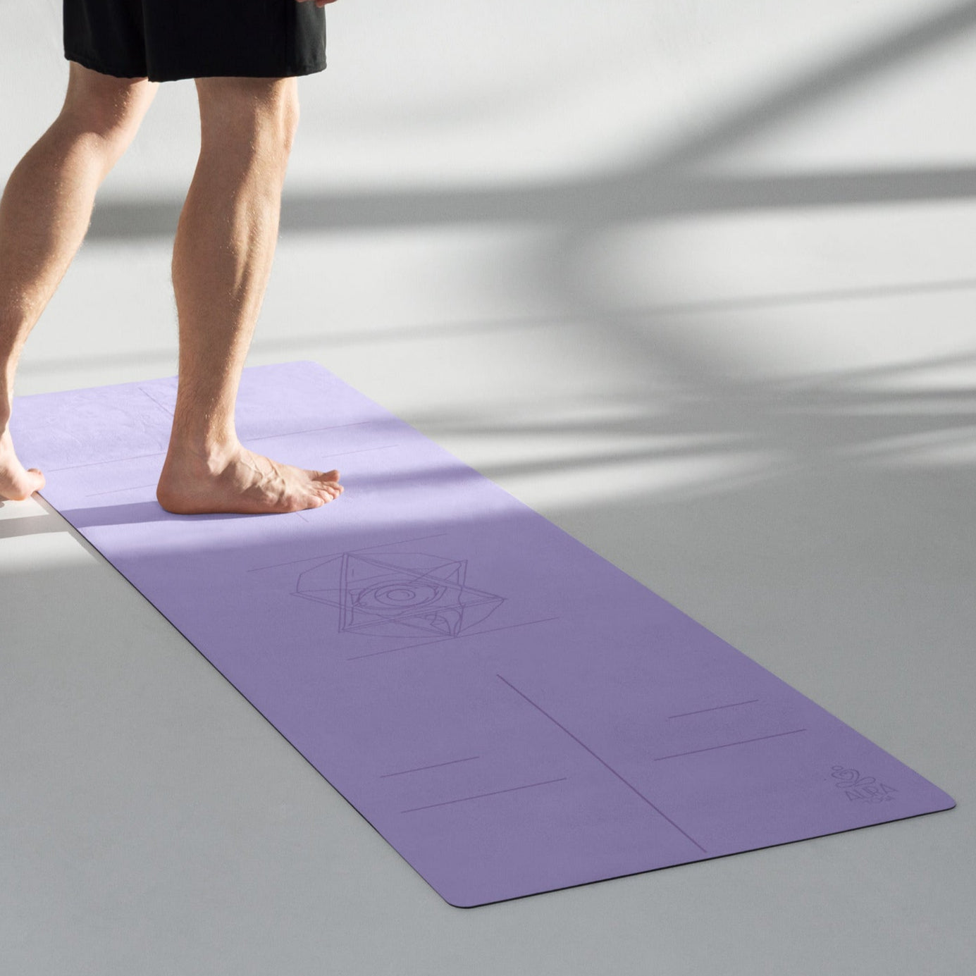 Lavender Suede Yoga Mat with a Third Eye symbol in the center and alignment lines.