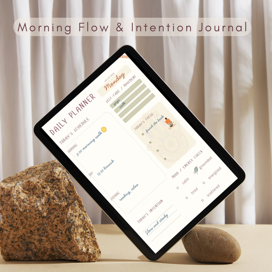 Digital tablet displaying a daily planner from the Morning flow yoga journal on a table in cozy room.