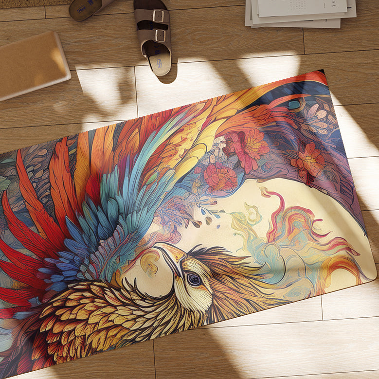 Detail of vibrant yoga mat with phoenix design on the wooden floor.