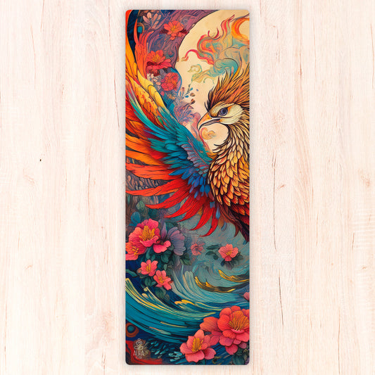 Colorful suede yoga mat with a phoenix design on a wooden surface